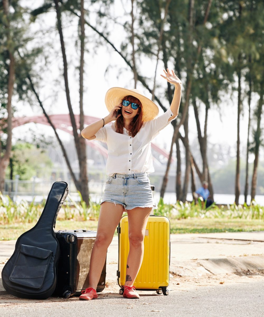 female-traveler-trying-to-chatch-car.jpg